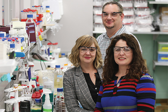 photo of three people in lab