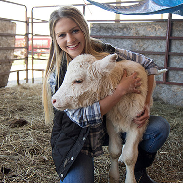 Libby Martin hugging calf