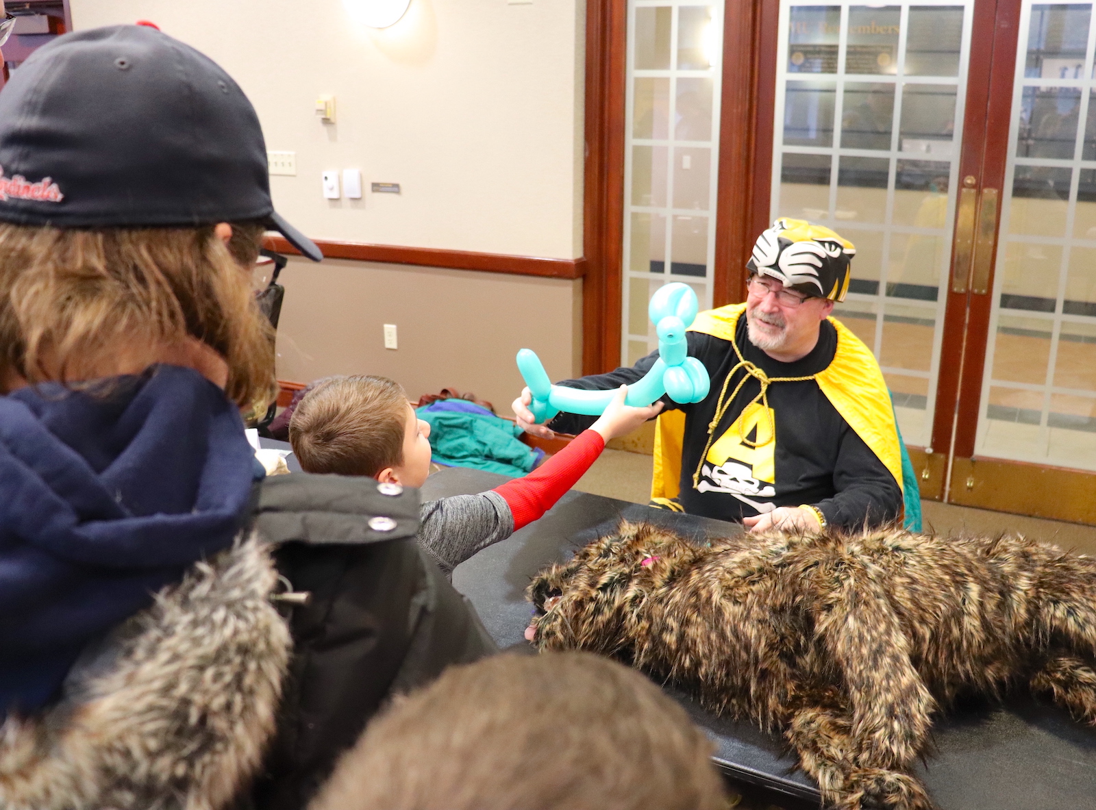 About 600 children and their parents explored University of Missouri science, technology, engineering and math research and creative activity hands-on during the Columbia Young Scientists Expo. Here, a researcher makes balloon animals for children.