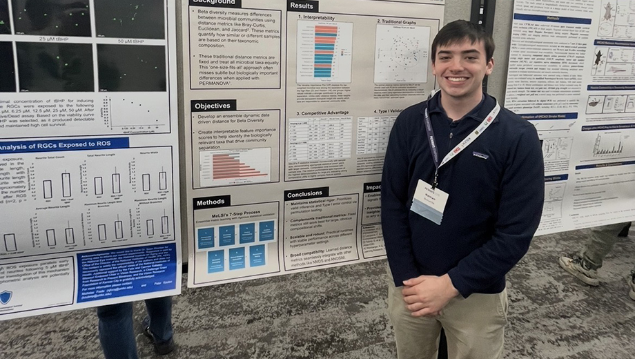 Nathan Bresette with his research poster.