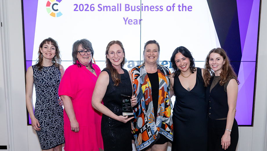 Partner for Better staff hold their 2026 Small Business of the Year award.