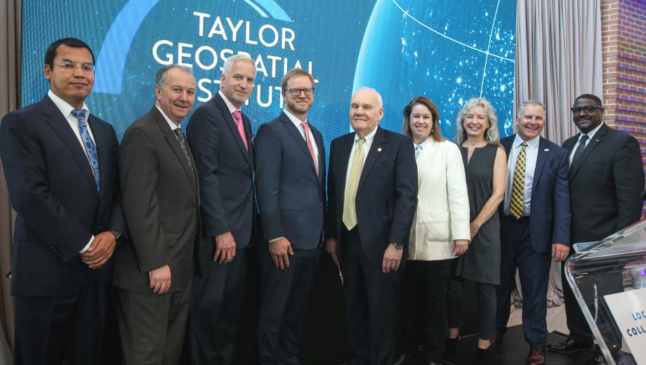 Members of the eight Missouri and Illinois research institutions forming the Taylor Geospatial Institute are joined by Andrew C. Taylor (pictured in the middle), executive chairman of Enterprise Holdings, Inc. and founding chair of Greater St. Louis, Inc. 