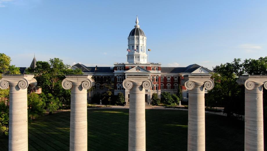 Photo is aerial of University of Missouri campus showing Columns and Jesse Hall.