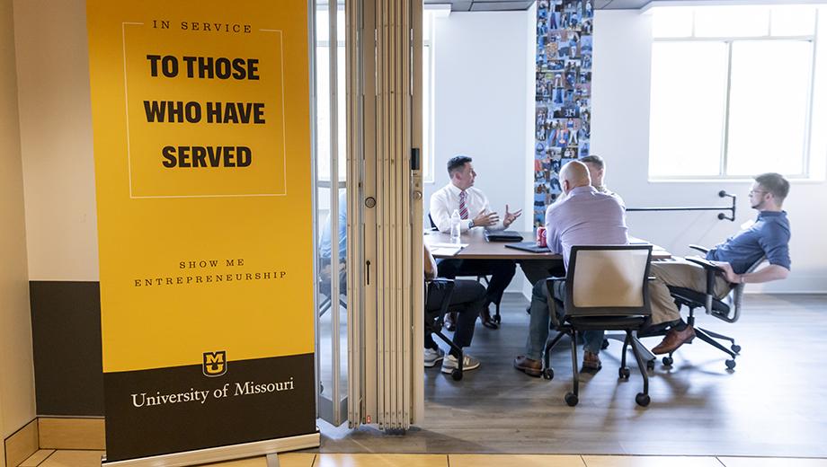 Left, Mike Moran, vice president of Hawthorn Bank, discusses banking services and U.S. Small Business Administration loans in a “genius bar” session with participants enrolled in Mizzou’s eight annual Entrepreneurship Bootcamp for Veterans.