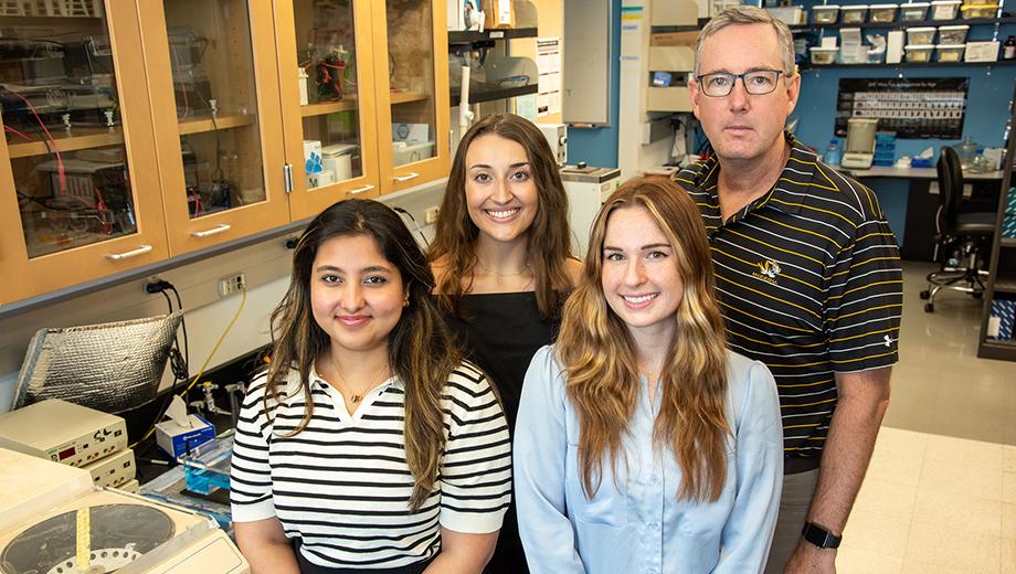 Left to right: Shift Pharmaceuticals research specialists Tanishka Kuhrani, Leah Lepore and Juliette Baker work with Curator’s Distinguished Professor Chris Lorson at the Bond Life Sciences Center. 