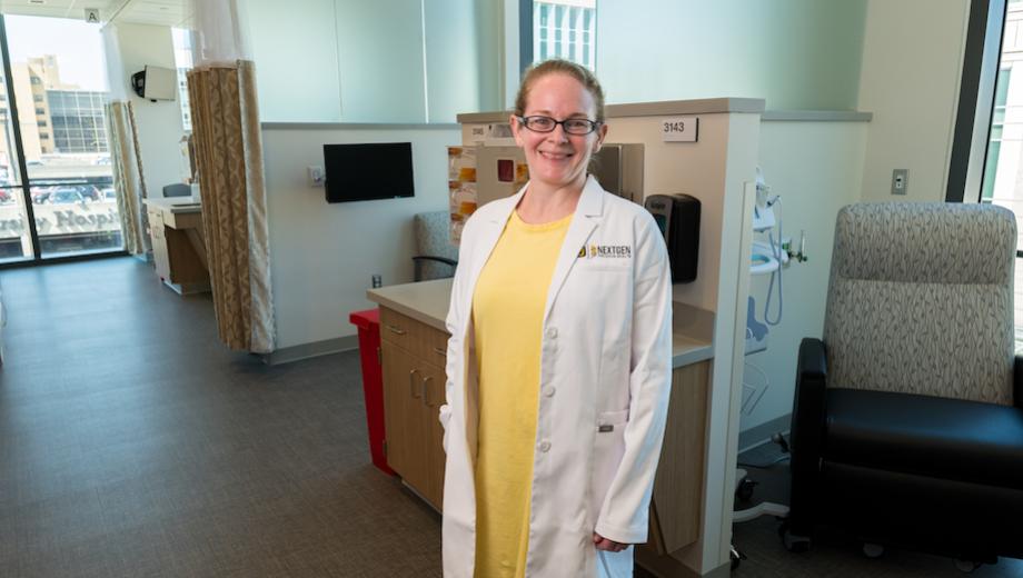 MU assistant research professor Kris Kelly is leading one of the first clinical trials to use the Clinical & Translational Science Unit (CTSU) in the Roy Blunt NextGen Precision Health building. She is pictured standing in the space.
