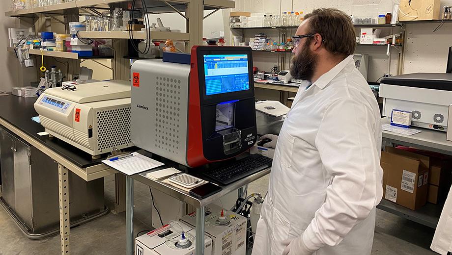 Christopher Johanning runs samples on the Luminex Intelliflex equipment.