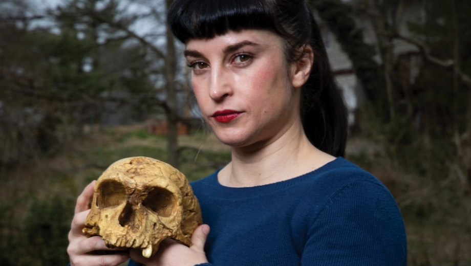 Libby Cowgill holds a skull