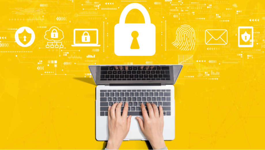 A person typing on a laptop with icons to symbolize research cybersecurity.