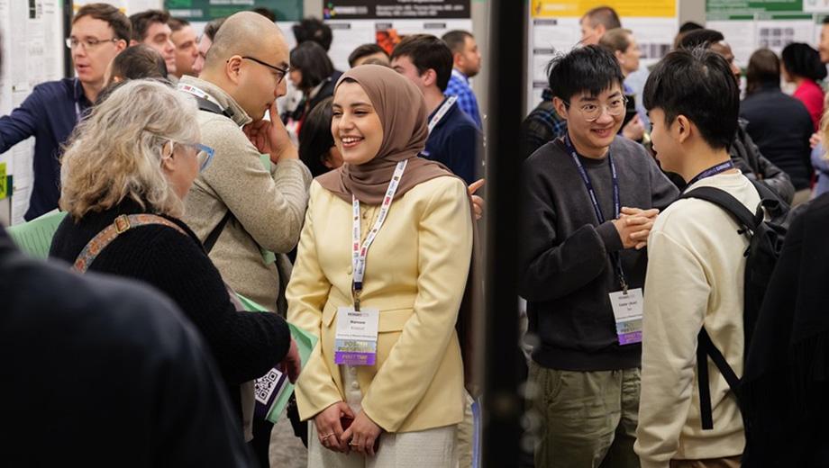 Pathways attendees discuss research posters