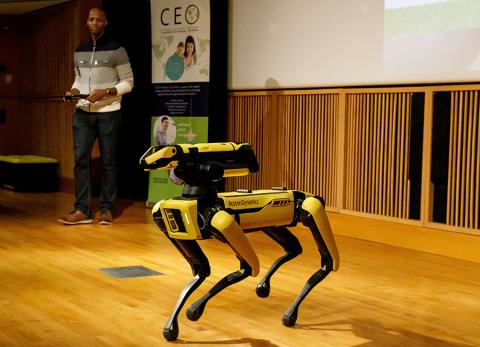Kristofferson Culmer demonstrates Spot, the robot dog.