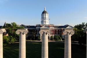 Photo is aerial of University of Missouri campus showing Columns and Jesse Hall.