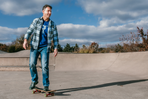 Rob Petrone rides a skateboard in a skatepark