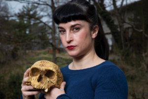 Libby Cowgill holding a skull.