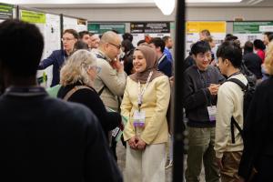 Pathways attendees discuss research posters